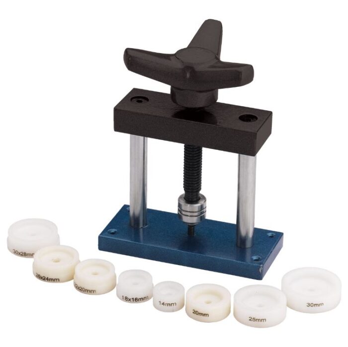 Prensa para cerrar relojes Anchor con 8 tazos de plástico.